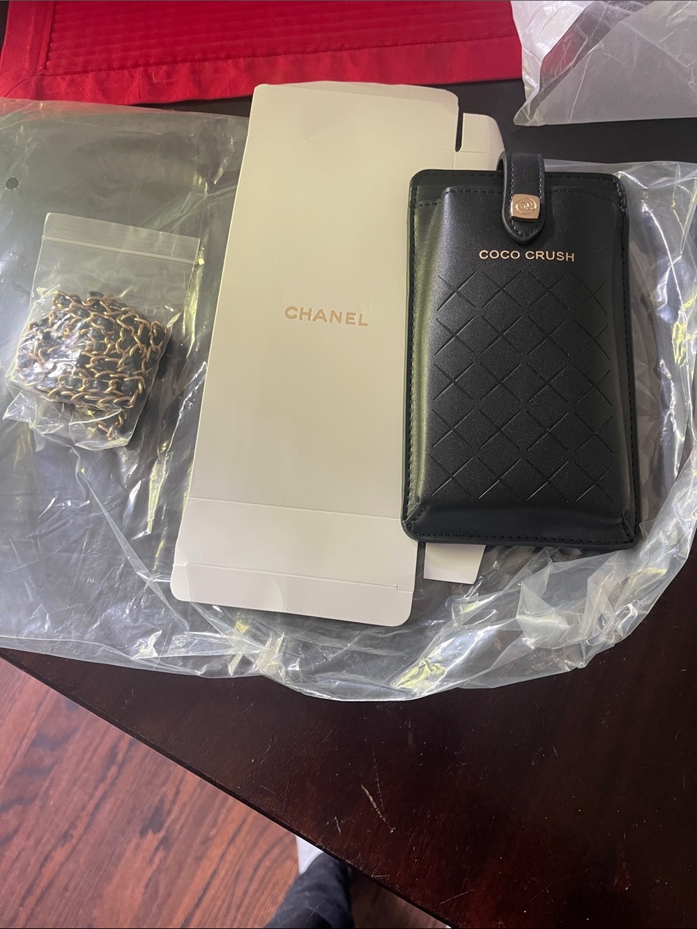 CHANEL Black Coco Crush Quilted Leather Phone Case with Gold Chain Accent